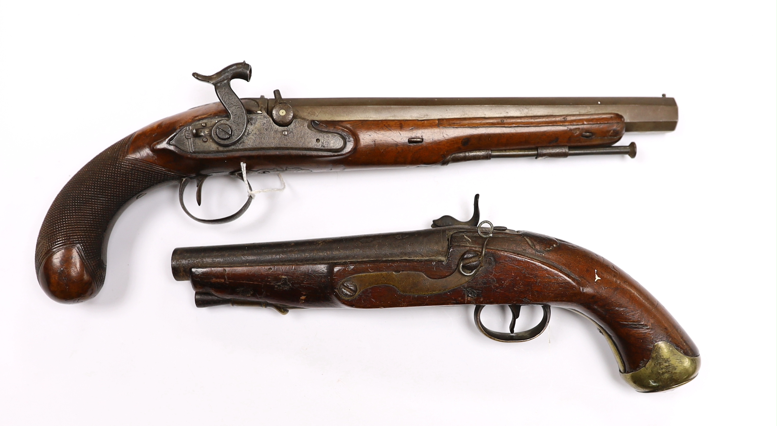 Two percussion 19th century pistols, both converted from flintlock, the larger example with engraved lock and hammer, octagonal barrel and chequered grip, together with a smaller overcoat pistol, fully stocked with brass